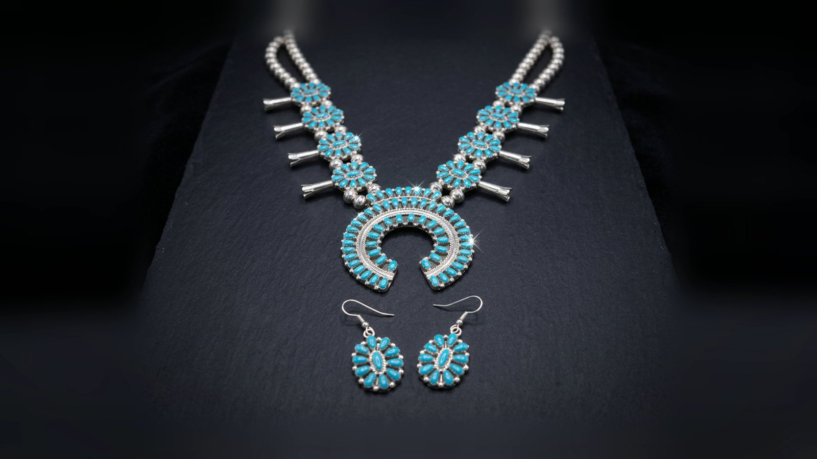 Kingman turquoise in pieces in stock: a reversible set, a bear pendant, hoops, a reversible pendant and squash blossom No. 007